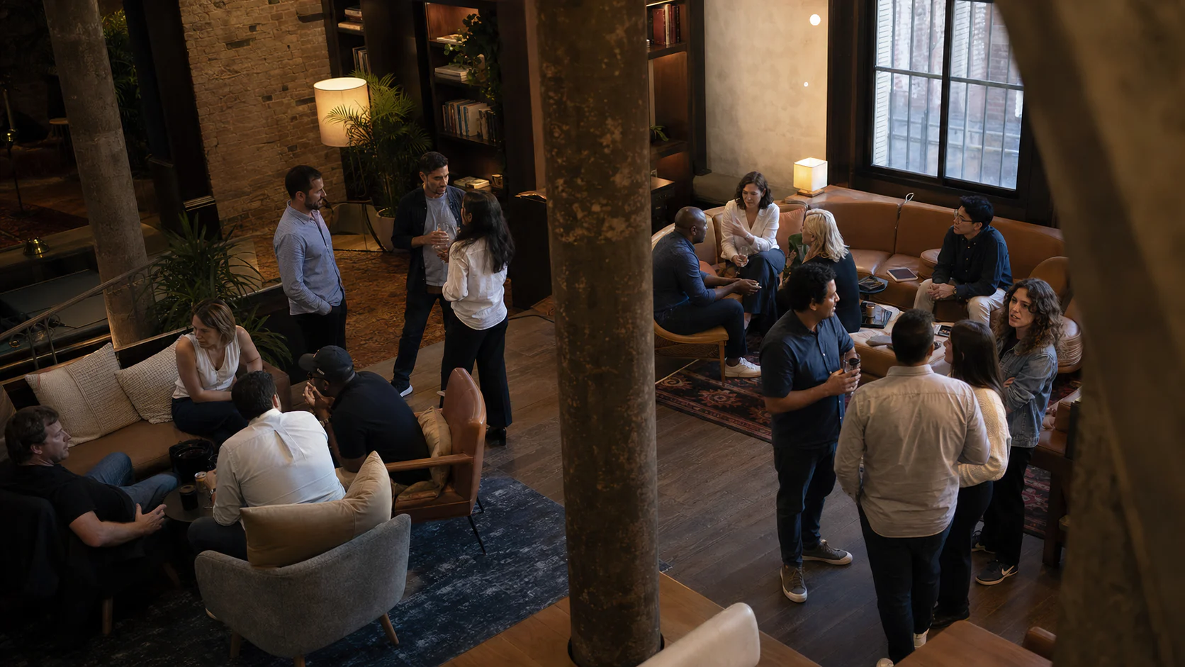 Editorial scene of founders and operators in small-group conversations